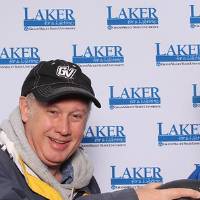 Two men holding football